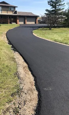 Freshly paved residential asphalt driveway in Calgary